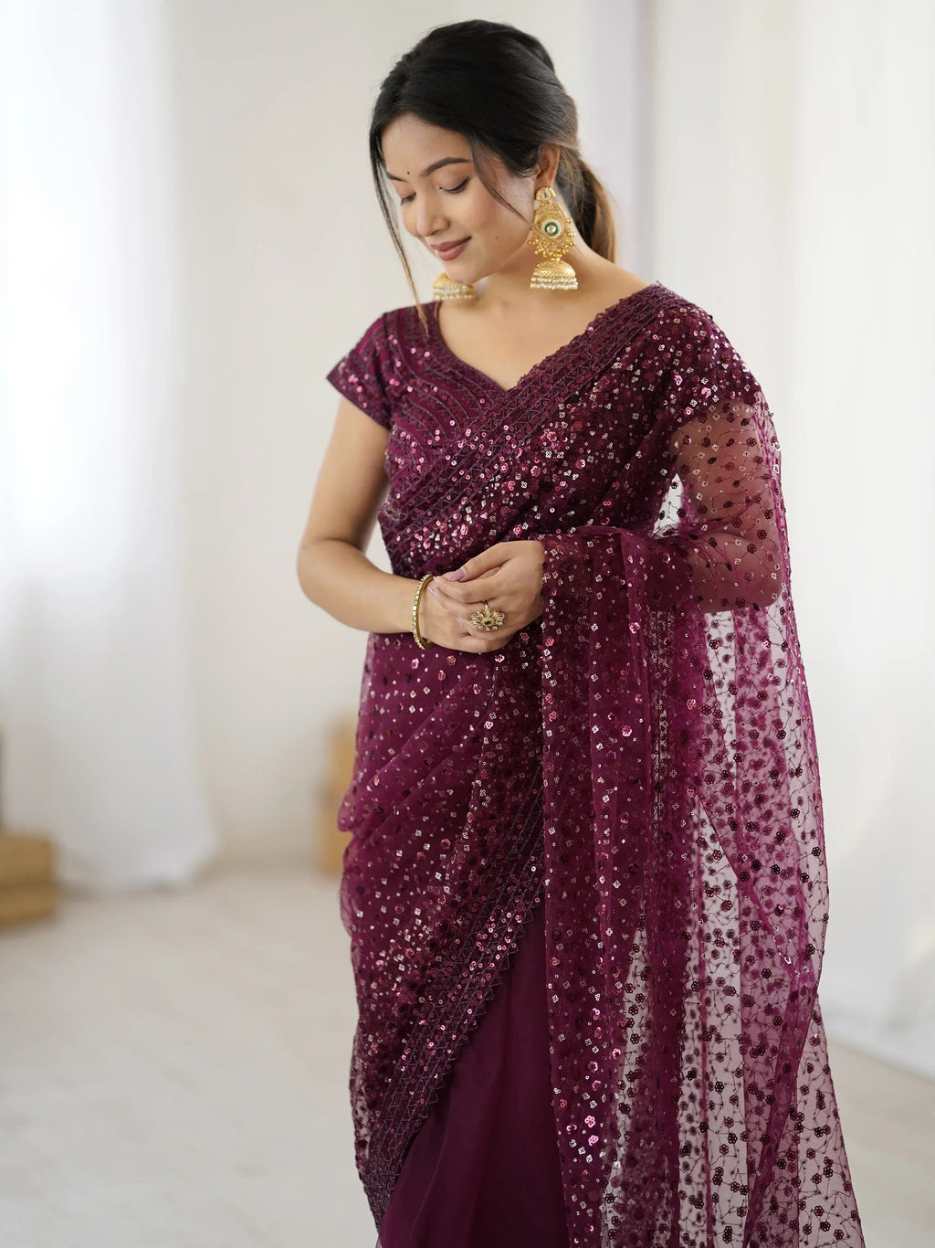 Glamourous Wine Sequins Net Festival Wear Saree With Blouse