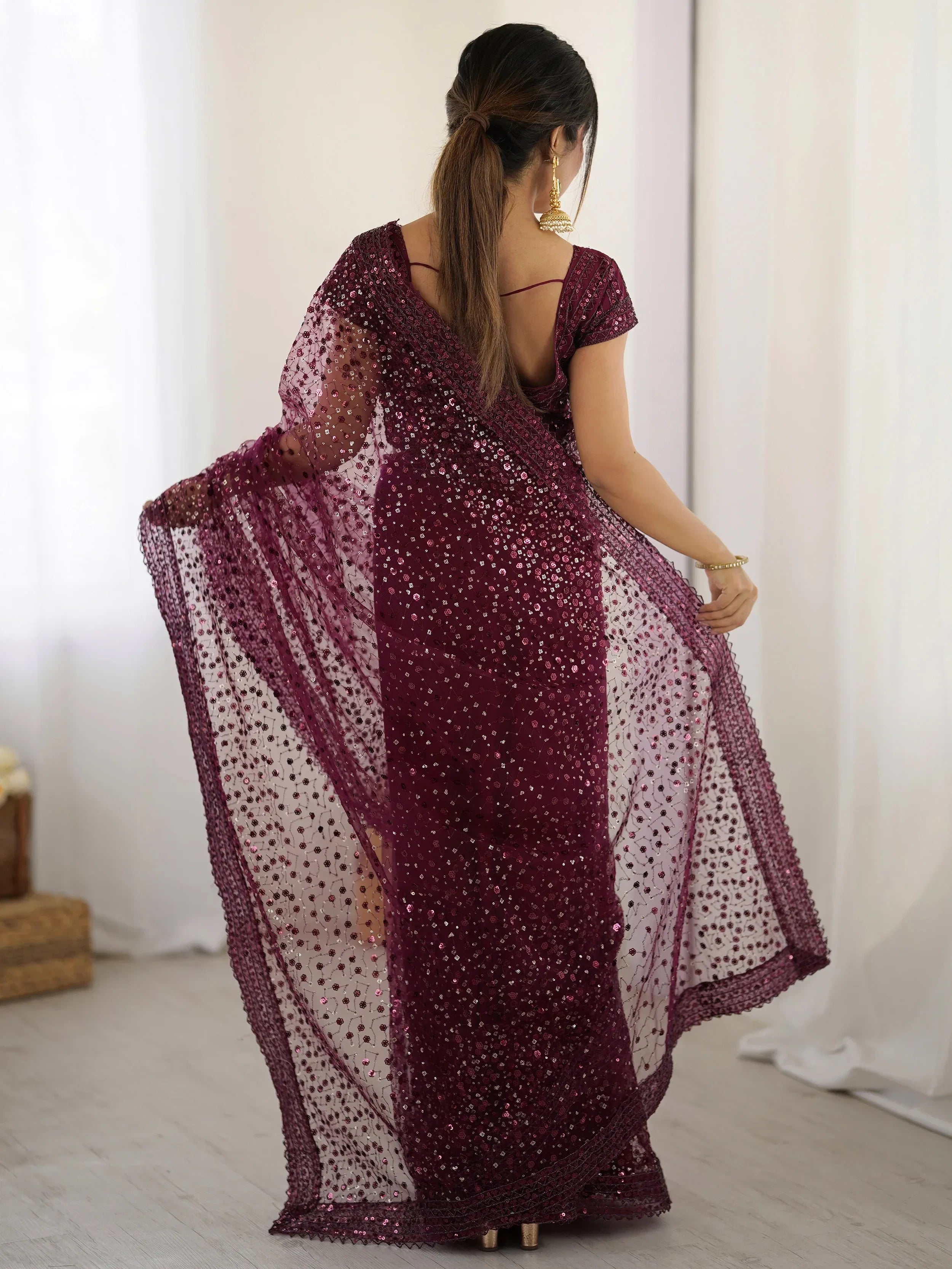 Glamourous Wine Sequins Net Festival Wear Saree With Blouse